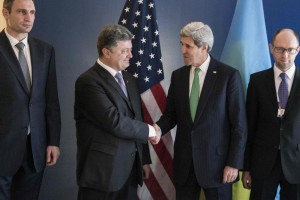 Poroshenko and Kerry shake hands prior to a meeting during the Munich Security Conference
